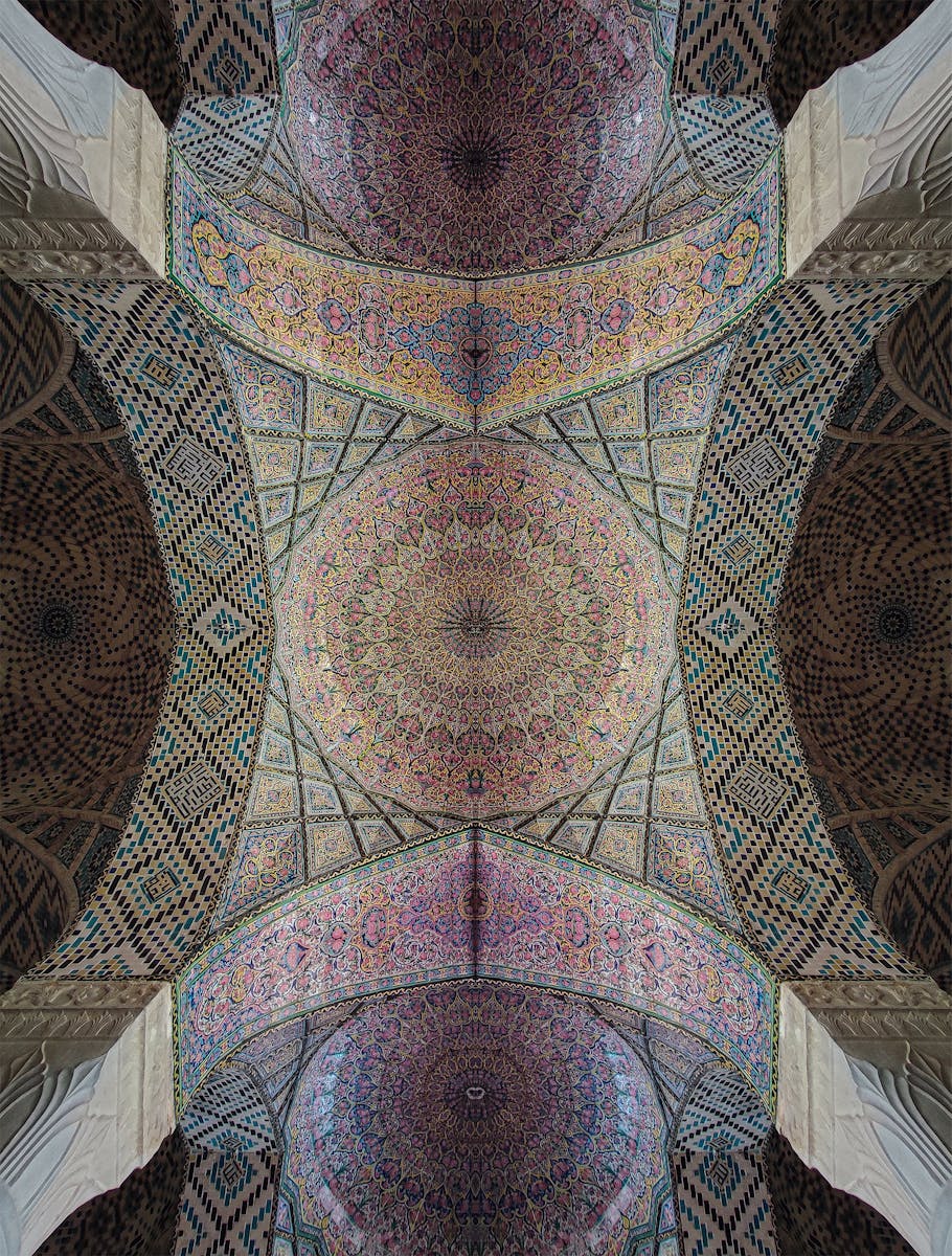 Detailed view of an ornate mosaic dome in a mosque in Shiraz, Iran.